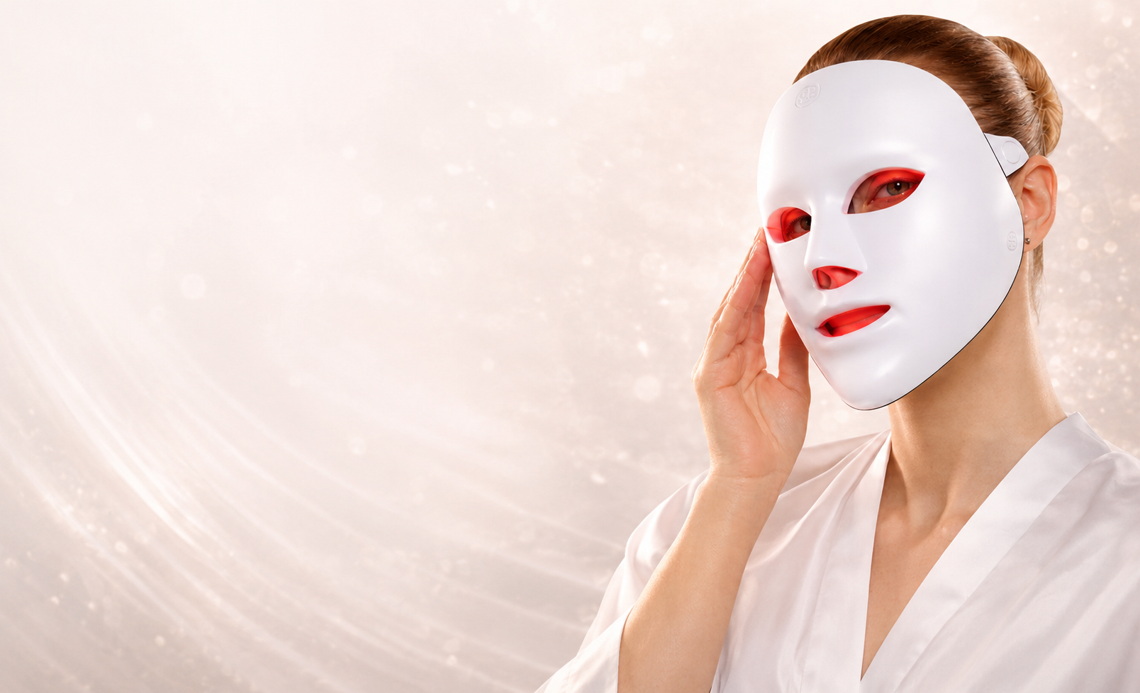 Woman wearing the NŌRE LumiMask LED light therapy face mask